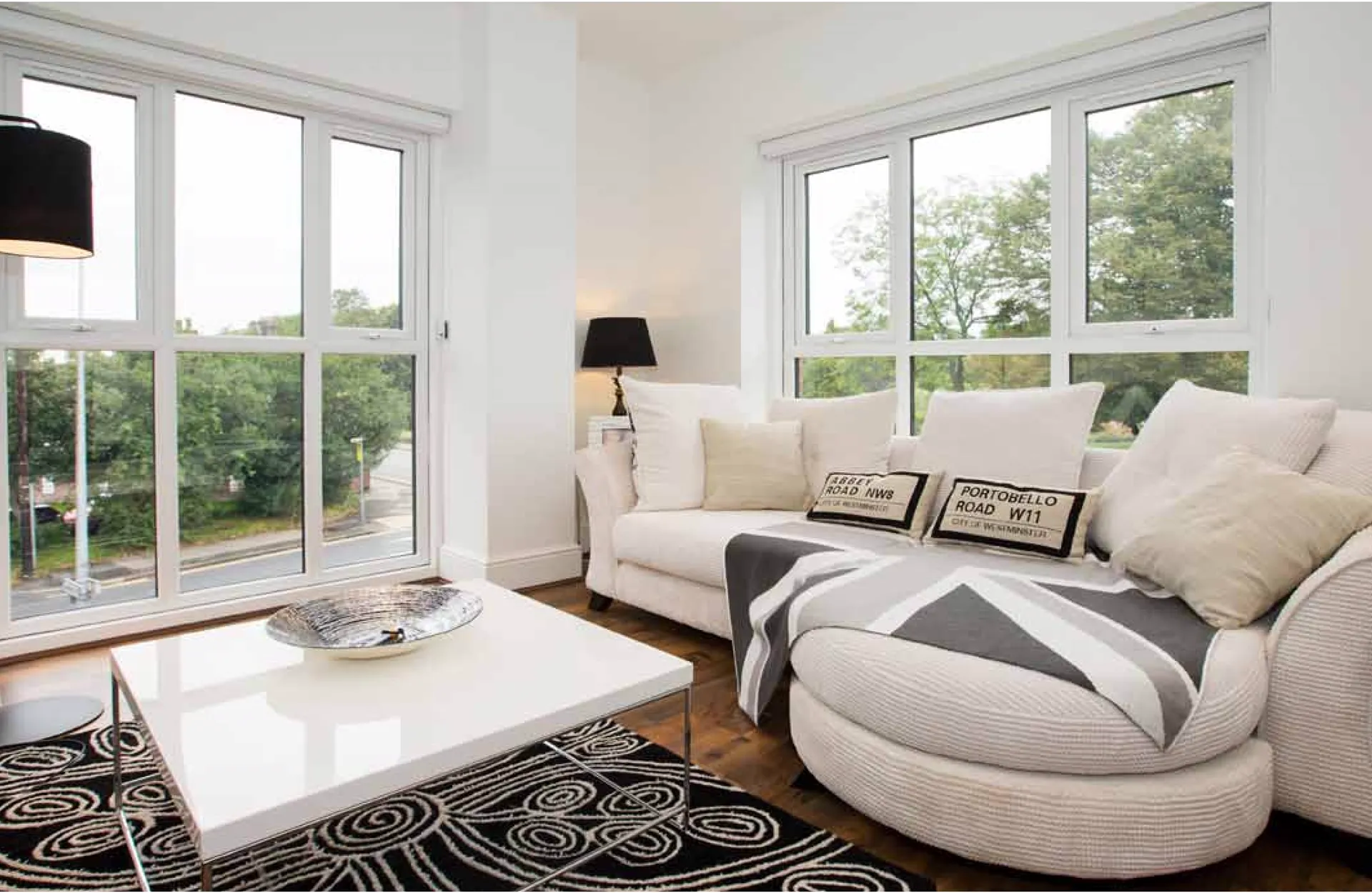 Bright living room with white-framed windows