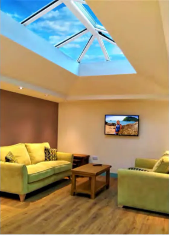 Living room with a roof lantern above a seating area