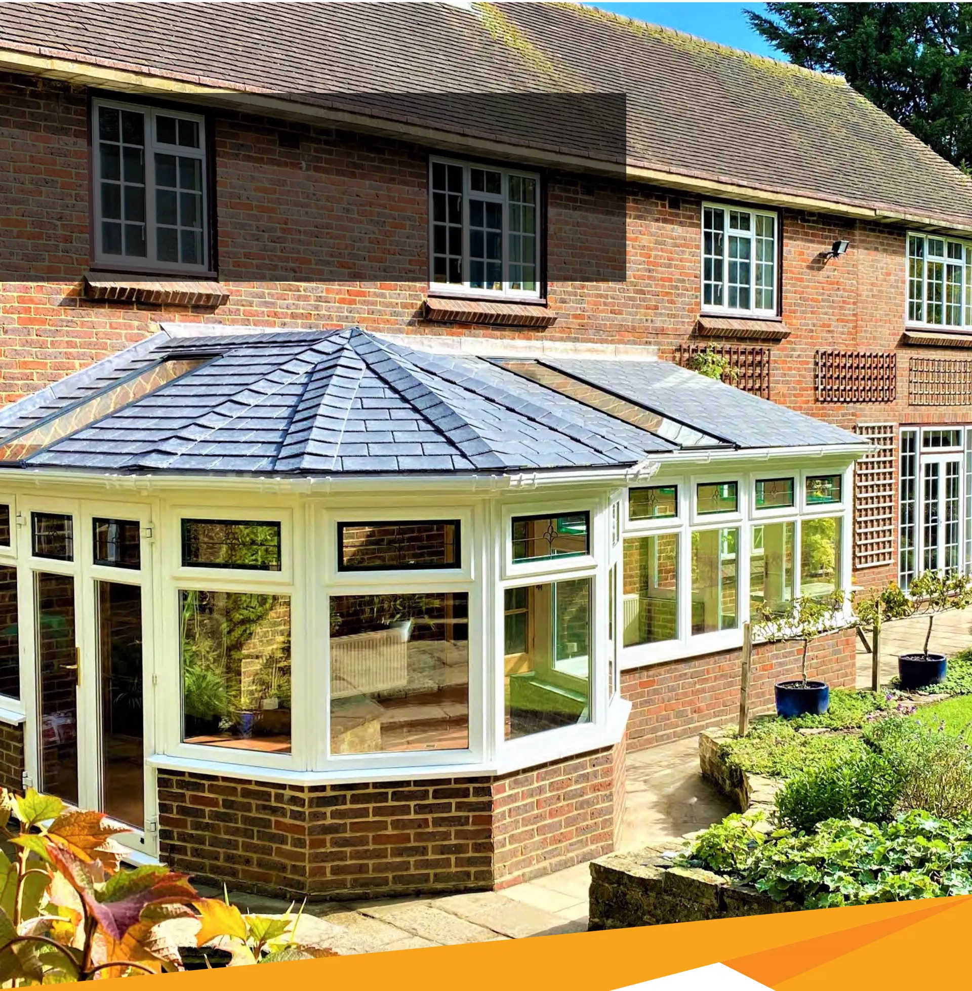 Conservatory with a tiled roof and rooflights