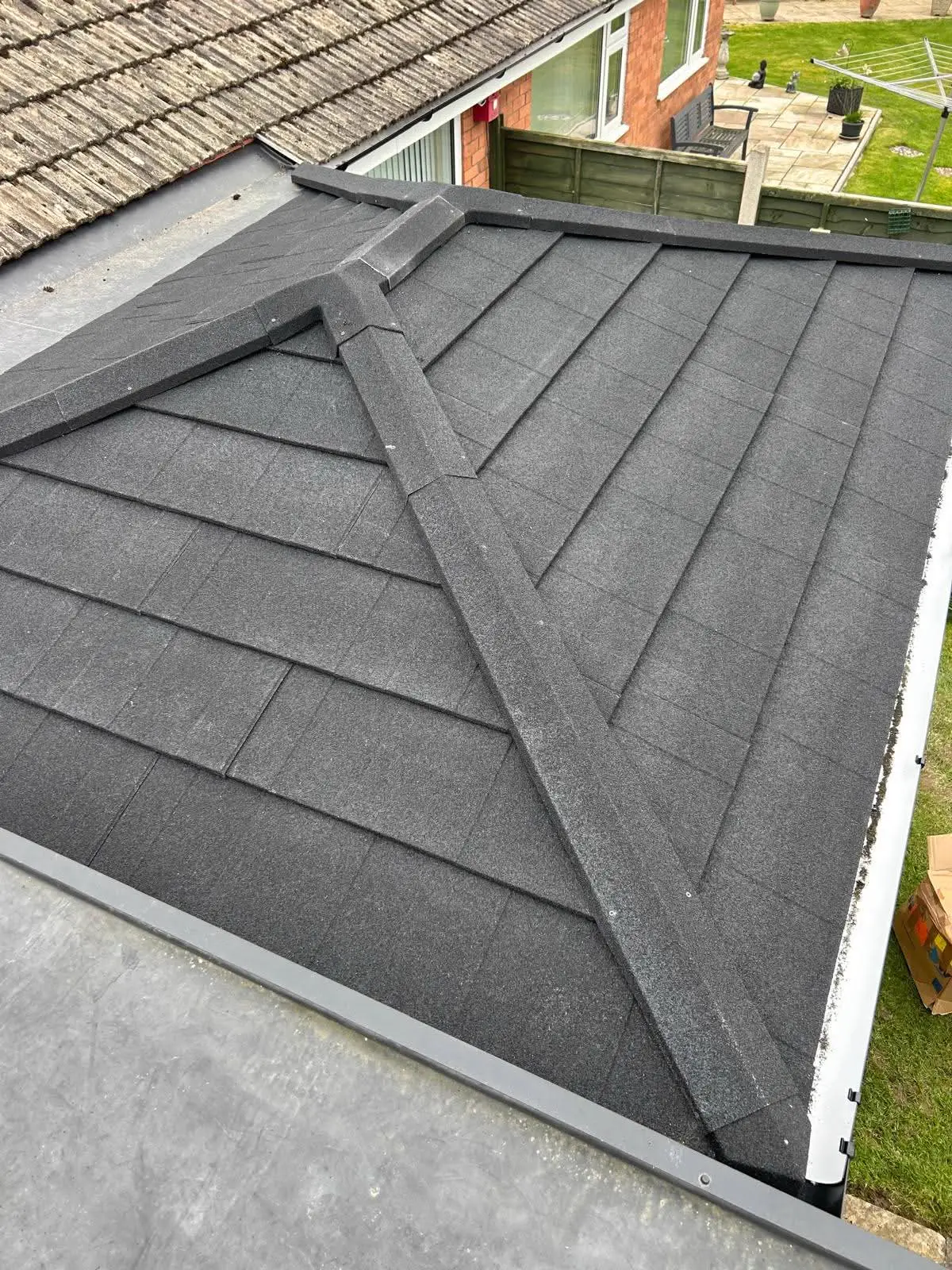 Close view of a tiled conservatory roof and its ridge detail